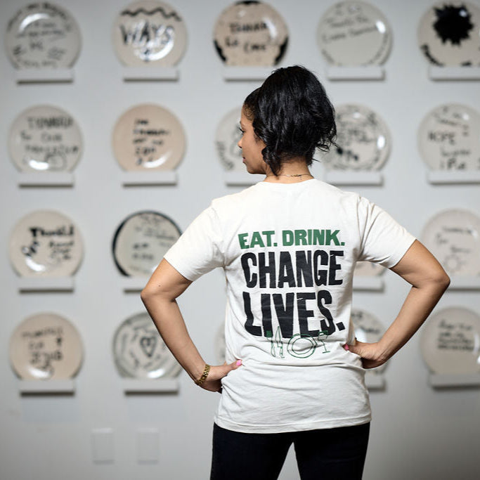 Eat. Drink. Change Lives. Tee (Heather Cement)